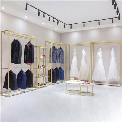 Étagère à vêtements dorée en tissu métallique d'affichage de magasin